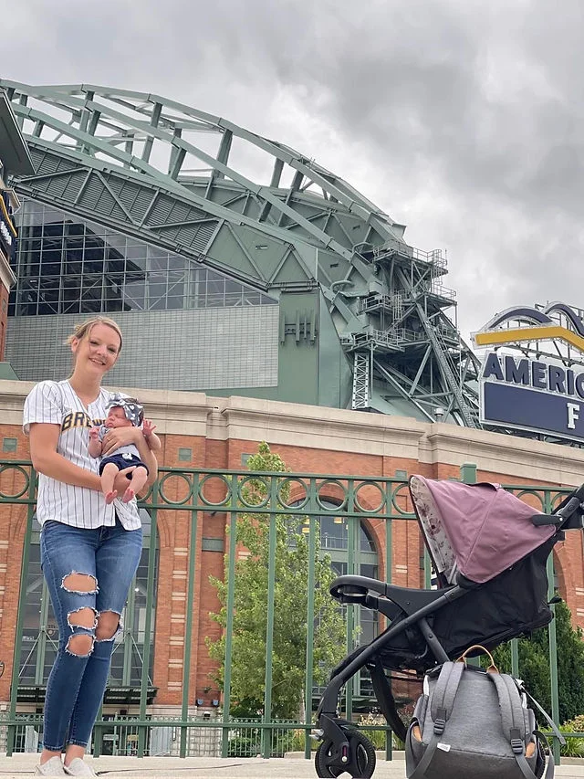 mom and baby outside the game venue
