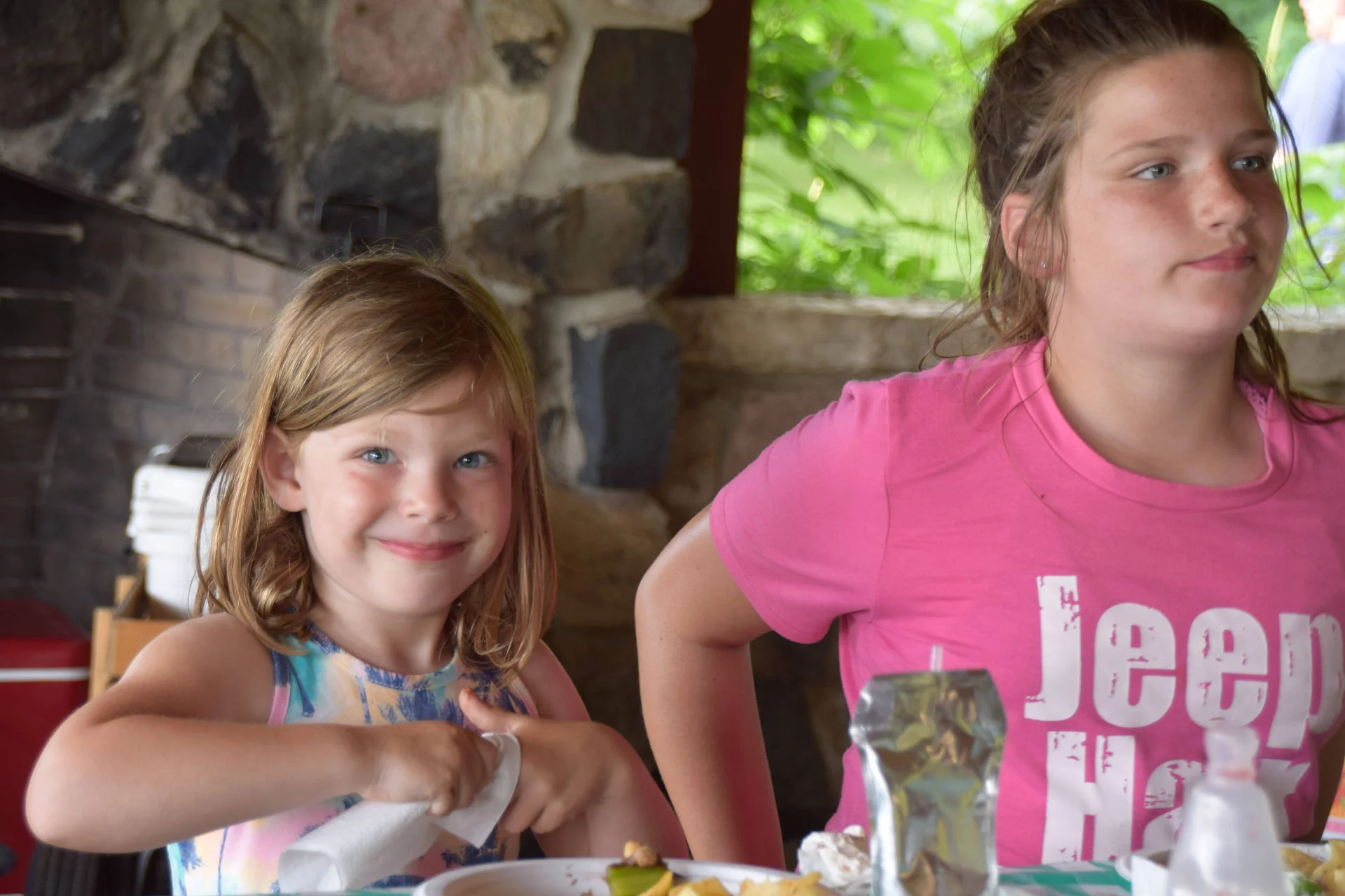 Photos of food, happenings, staff and family during the company picnic event